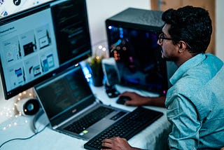 A man sitting in front of laptop