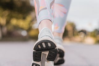 woman walking for exercise in her asics