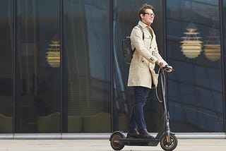 A man using his electric scooter.