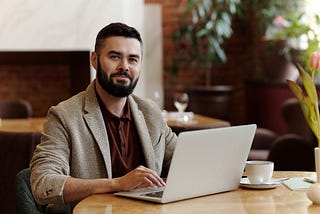 Man working online in a cafe