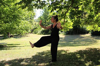 A woman practices Tai Chi and Wu Wei