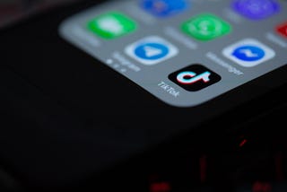iPhone homescreen with focus on the TikTok app icon