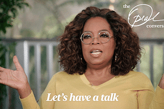 Oprah Winfrey saying “Let’s have a talk” in a yellow shirt while gesturing with her hands