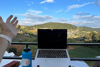 view of laptop and mountainous valley