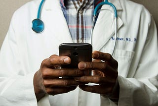 A virtual Primary Care doctor is messaging on the mobile phone