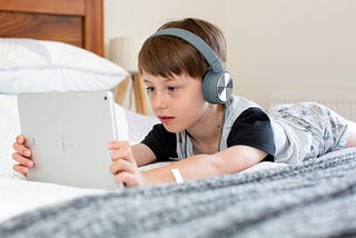 Picture of a boy wearing headphones