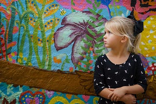 sad little girl, alone, looking of into the distance