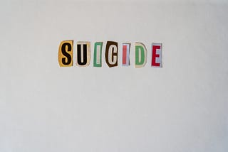 Colorful letters cut from a magazine spell the word suicide. It’s in effect a suicide note.