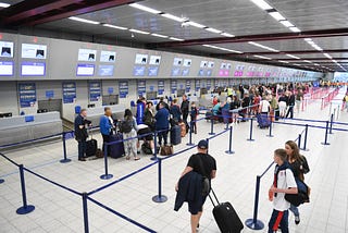 Airport picture showing passengers in a queue