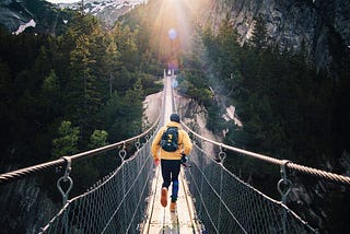 We were at this beautiful brige in murren , in the bernese Oberlan in switzerland with some friend, when i tell my friend to run like if he would catch the last ray.