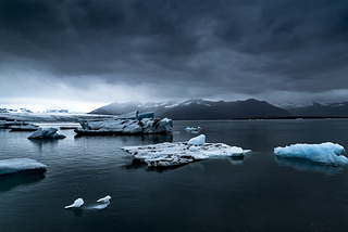 A view of Icelandic sea ice on a dark, grey day.