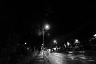 empty road at night with street lamp