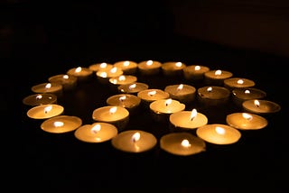 Candles forming the peace symbol