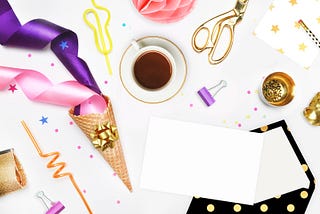 Ribbons, scissors and envelops to decorate for a retirement party.