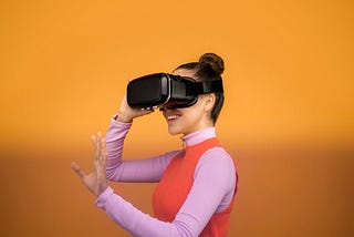 Person experiencing the Metaverse with a VR headset.