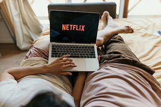 A couple watching Netflix