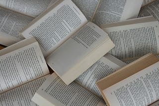 A collection of books with open pages