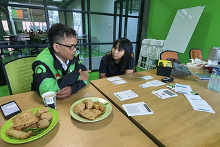 Picture of me interviewing Gojek driver for user journey study