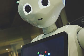 creepy looking robot with a screen on it’s chest