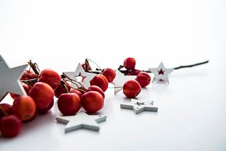 Christmas ornaments lying on the floor red and white.