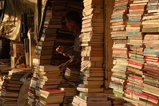 Books stacked high in modern-day Iraq