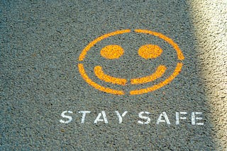 Smile face with the words stay safe