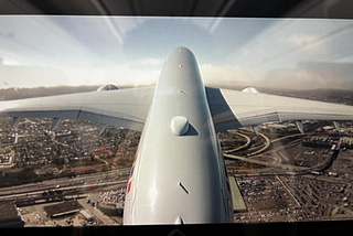 Photo of a plane wing through the window