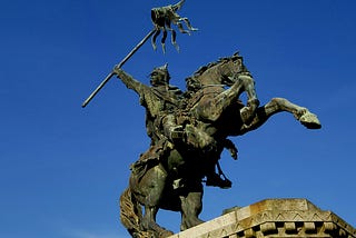 An armed Norman warrior on a rearing stallion.