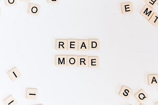 Scrabble tiles with “Read More”.