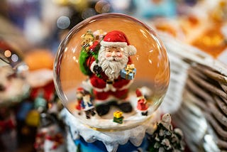 Porcelain Santa inside a snow globe.