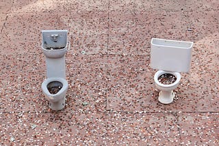Miniature toilets full of coins