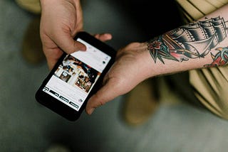 Image of a person reading a Pinterest recipe on his phone.