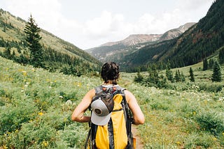 Person hiking in nature for health benefits