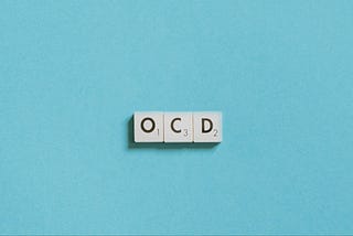 A simple text that spells ‘OCD’