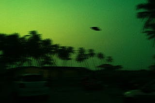 a blurry image of a flying saucer in the night sky