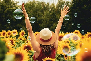 happy woman in a field of sunflowers