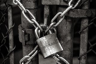 An image of a padlock with chains