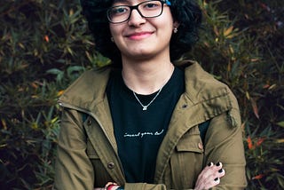 📸📸 Insta: @ntlmccarthy | Smiling girl with crossed arms looking at the camera.
