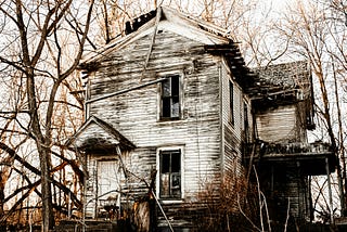 An old rundown house in disrepair.