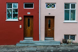 Two adjacent doors, representing the choice of how to move forward