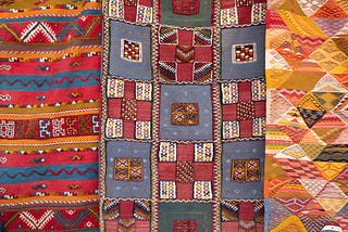 Three patchwork quilts