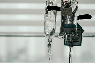 Image of two drip bags in a hospital.