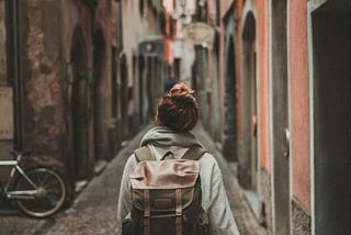 Female walking through city