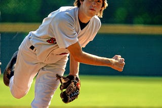 Little league pitcher focused on striking out his enemy.