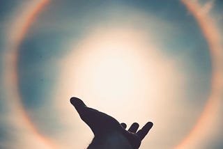 hand reaching up in worship — showing values