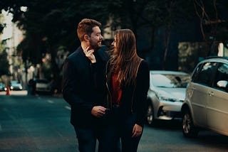 A couple posing on the streets.