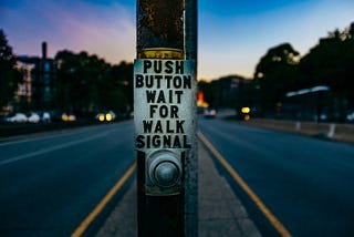 Push button wait for walk signal — Photo by Ashim D’Silva on Unsplash