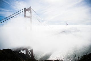This is a picture of the Golden Gate Bridge surrounded by fog