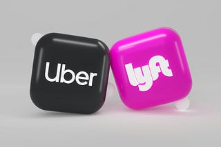 A black “Uber” button leans against a hot pink “Lyft” button.