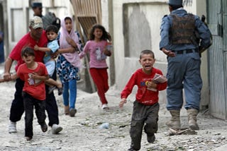 Afghan children seek refuge after hearing the blast